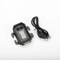 Portable tactical torch with USB cable mounted on a backpack strap.