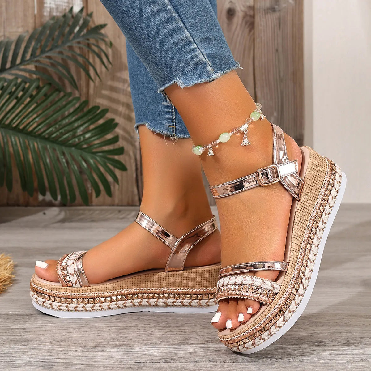 Gold women's wedge sandals with woven upper and round toe