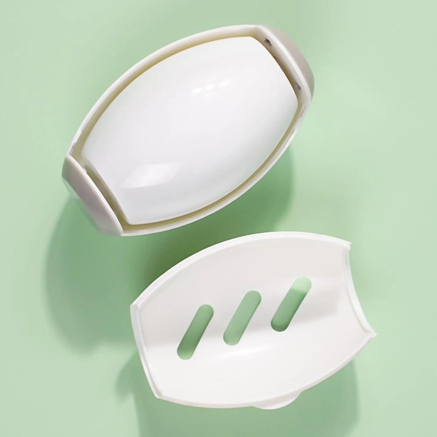 Green and white reusable gel lint roller ball for removing pet hair and lint from clothes.