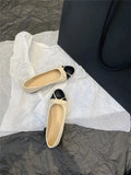 Women's apricot colour ballet flat pumps with a round toe and flat rubber sole.