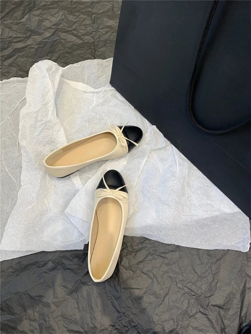 Women's apricot colour ballet flat pumps with a round toe and flat rubber sole.