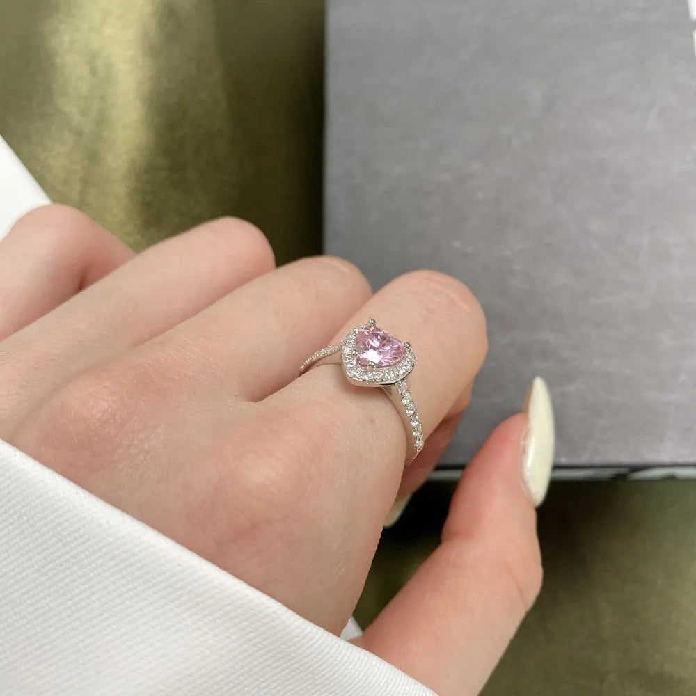 Women's S925 sterling silver heart-shaped ring in white diamond electroplated finish on white background