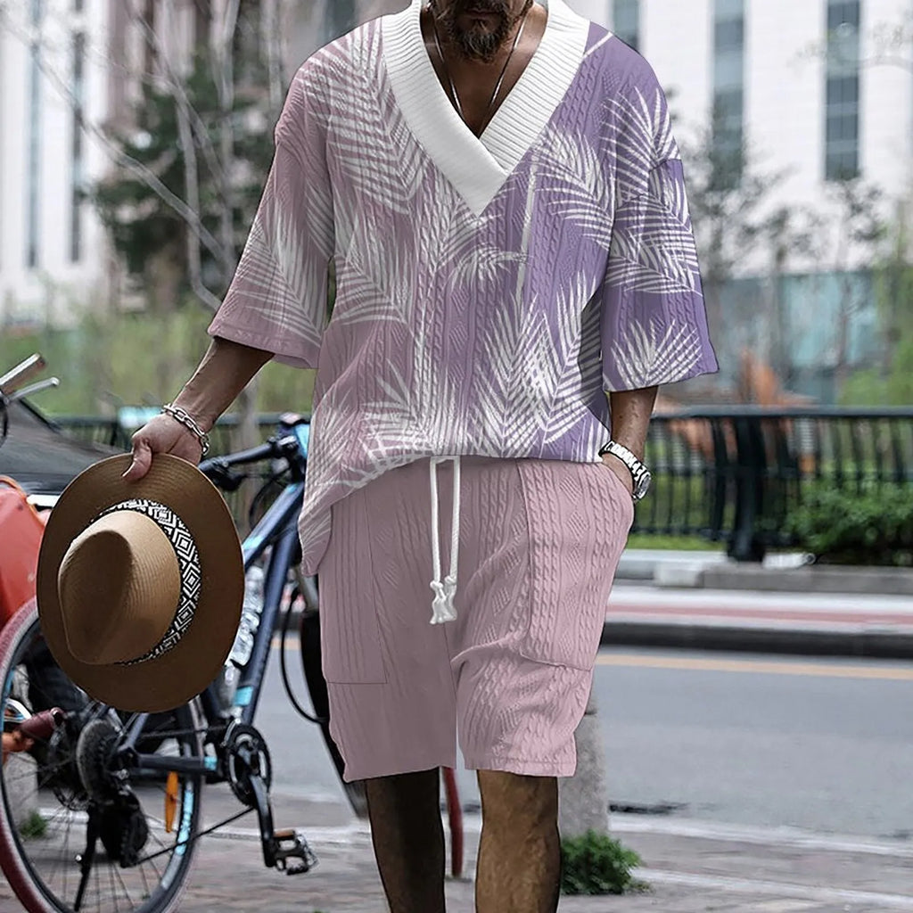 Man wearing a printed drop-shoulder short-sleeved knitted top with matching shorts.