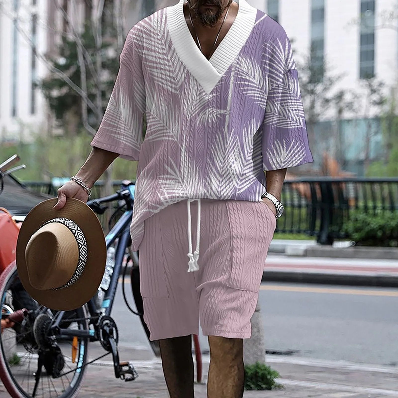 Man wearing a printed drop-shoulder short-sleeved knitted top with matching shorts.