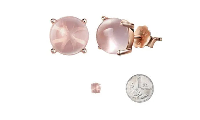 Rose gold drop shape stud earrings with crystal inlay detail on a silver base.