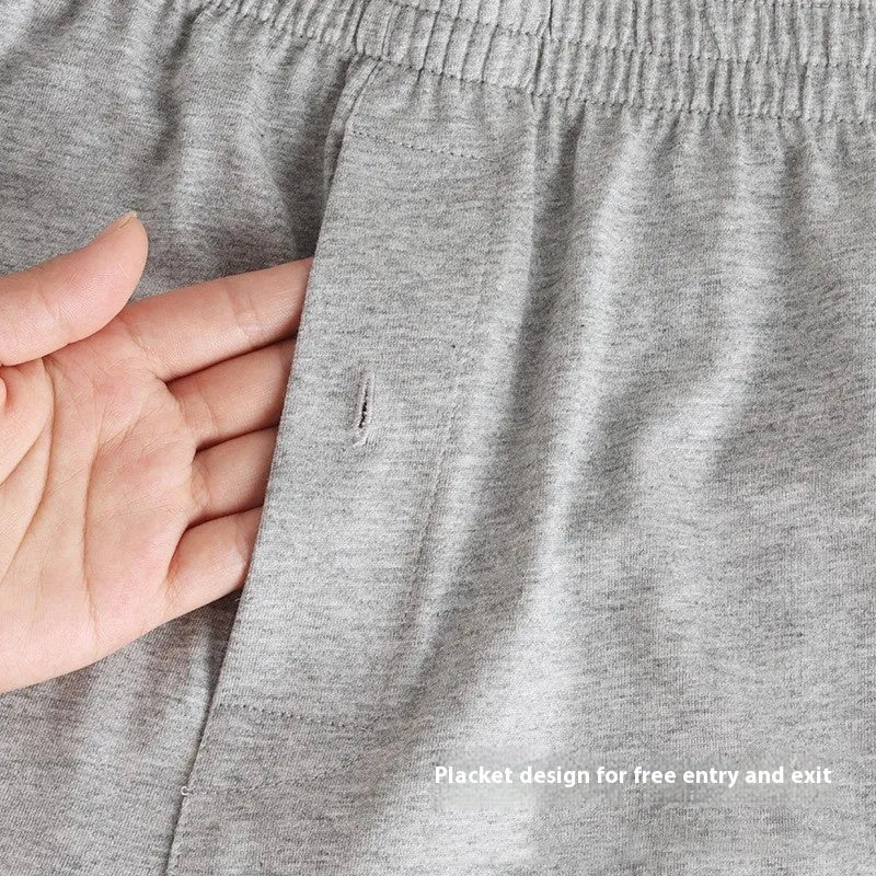Men's light grey high-waist cotton loose boxer shorts laid flat.