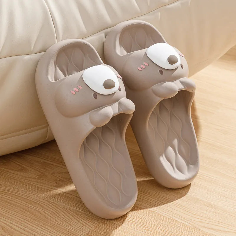 Pair of brown cartoon bear EVA flip flops for adults, toe baring sandal style