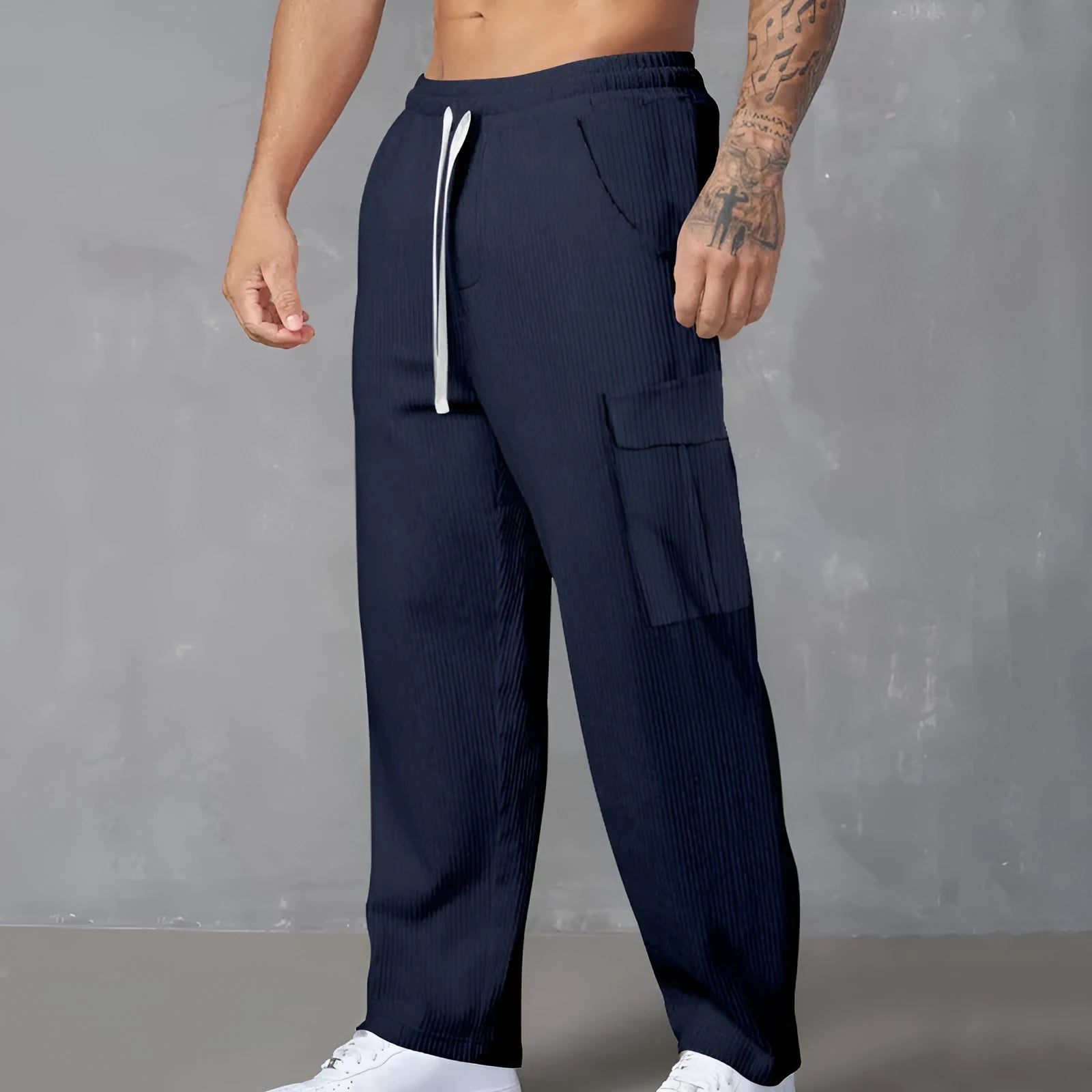 Men's straight-leg corduroy cargo trousers in a loose wide-leg fit with a drawstring waist.