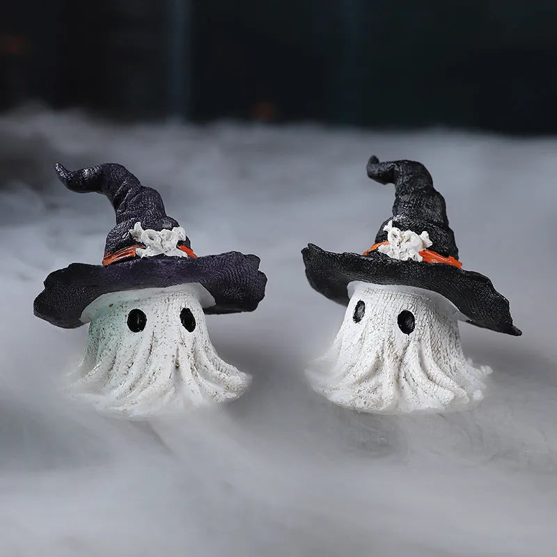 A purple and a black solid resin wizard hat ornament for holiday decoration.