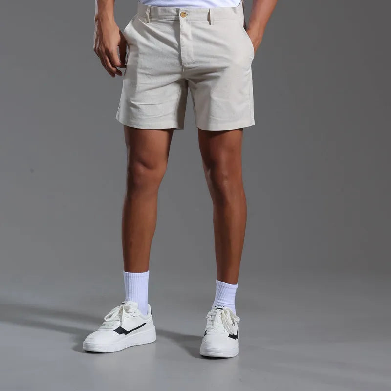 Men's loose plus size linen cotton blend casual shorts in green, side view, showing relaxed fit and mid-waist design.
