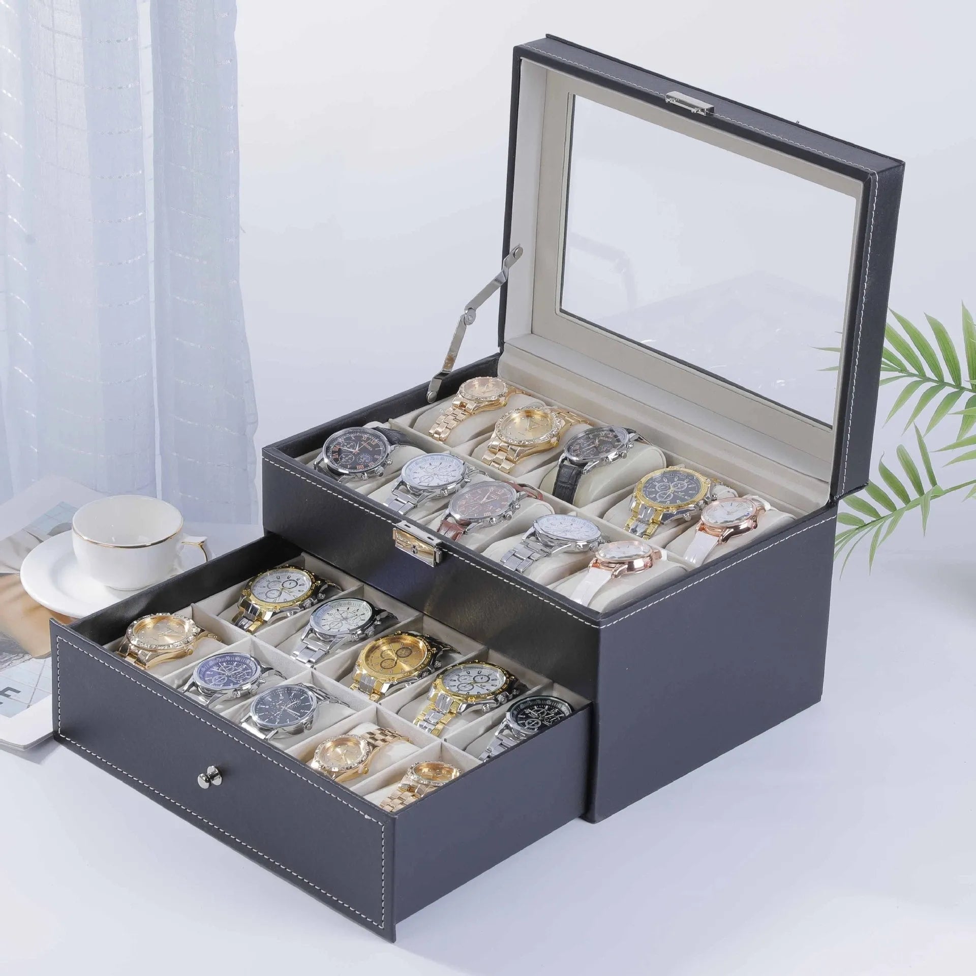 Grey leather watch storage box with a transparent dust cover, showing internal watch slots.