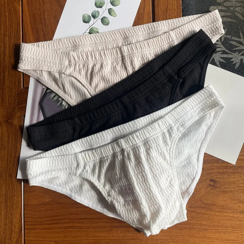 Men's solid colour cotton triangle underwear briefs showing mid waist design and available colour options