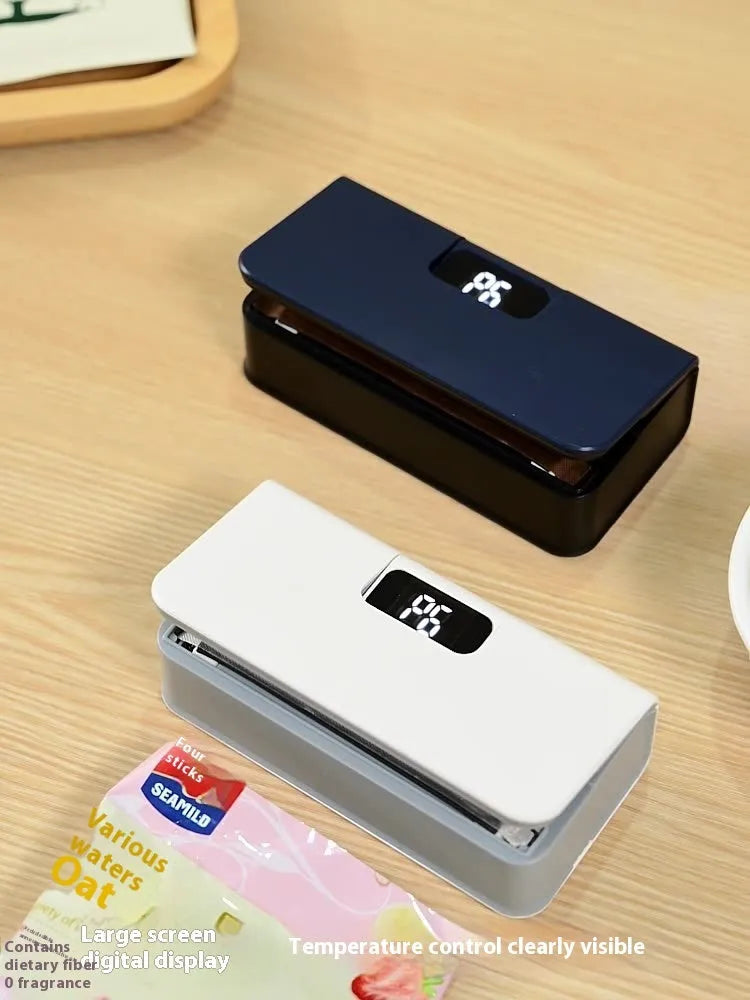 A small white handheld heat sealing machine for plastic bags on a plain background.