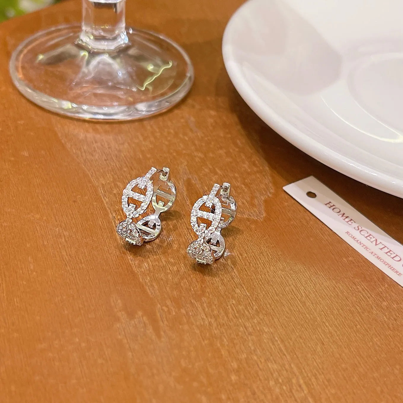 Women's diamond-design electroplated copper earrings in silver, gold, or rose gold finish.