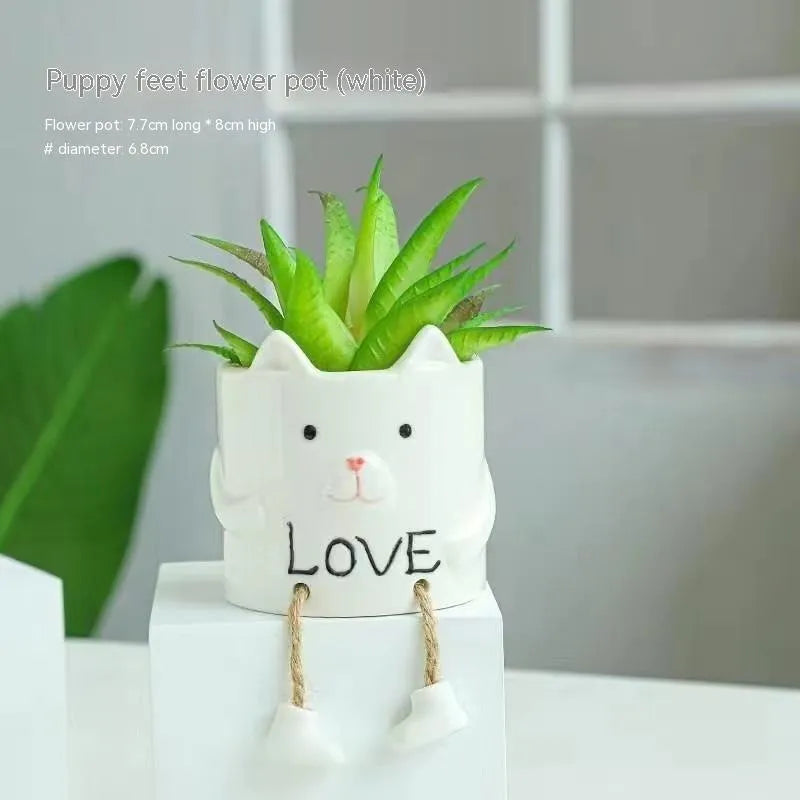 Ceramic hanging foot flowerpot in a cartoon style, shown as a desktop planter for succulent plants.