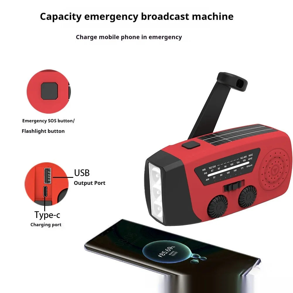 Red rechargeable emergency hand radio with built-in torch and wrist strap for disaster preparedness kits