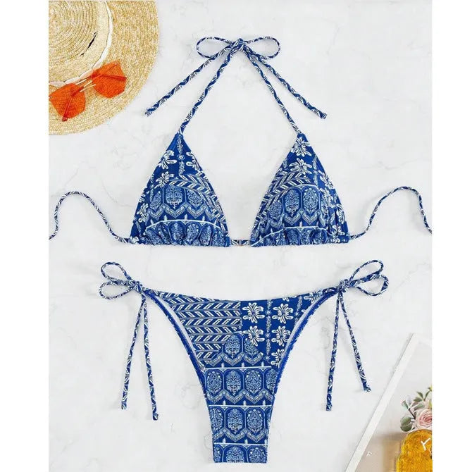 Women's green split bandage bikini with printed stitching on a mannequin.