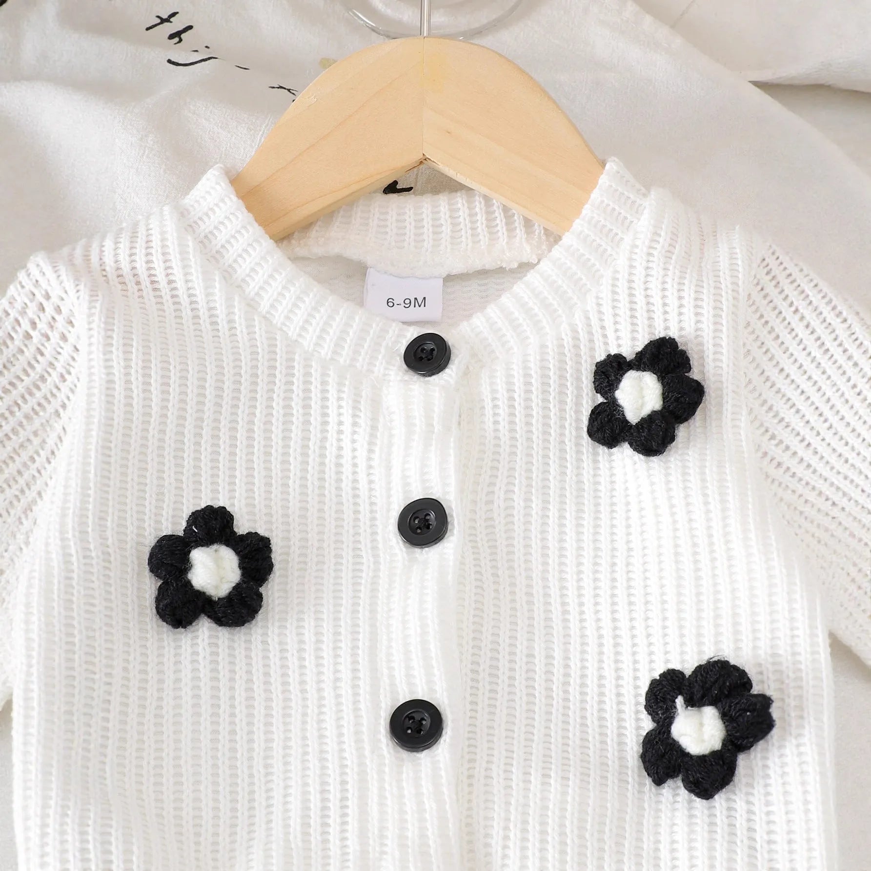 Baby girl cotton outfit set with white long-sleeved wool flower top and black trousers for toddlers 6 months to 3 years