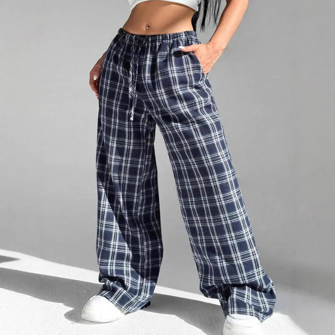 Women's loose fit plaid trousers with a drawstring waist and side pockets, shown in blue.
