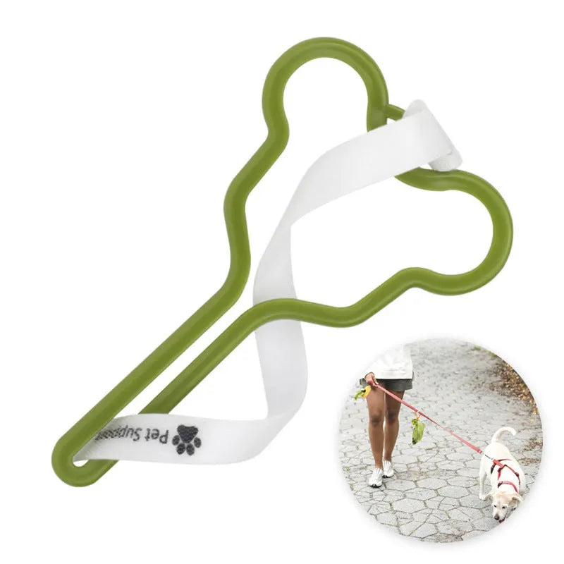 A hands-free dog poop bag holder with a hook and loop fastener strap, shown attached to a dog leash.