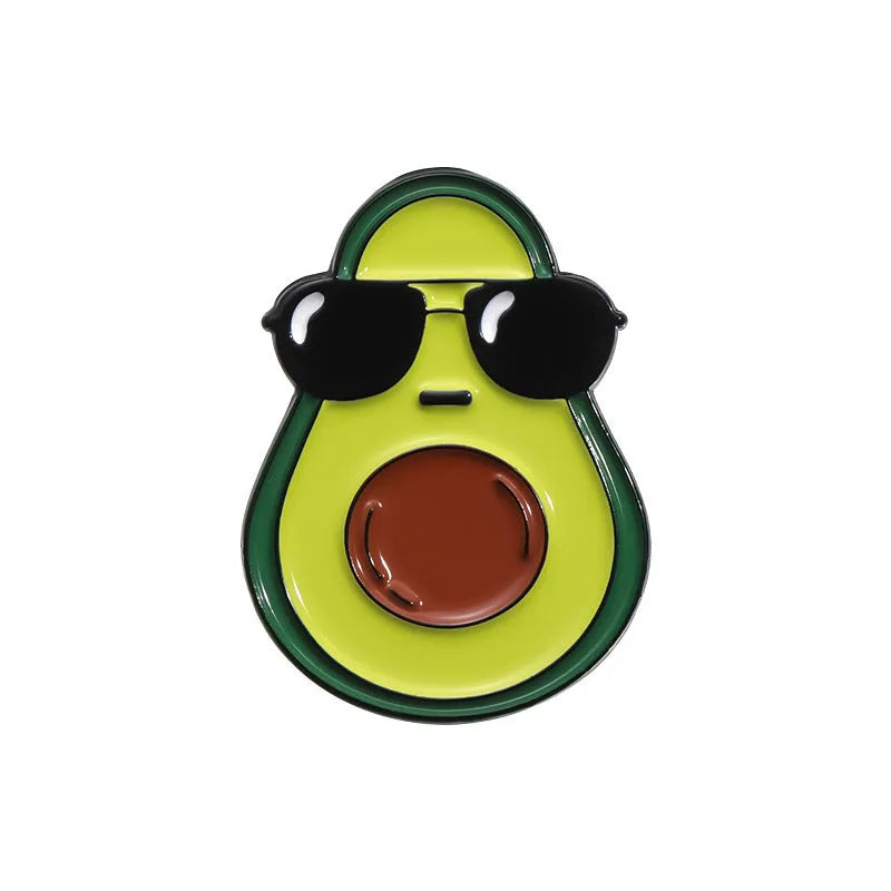 Colourful cartoon-style fruit metal brooch with a pin back on a denim jacket lapel.