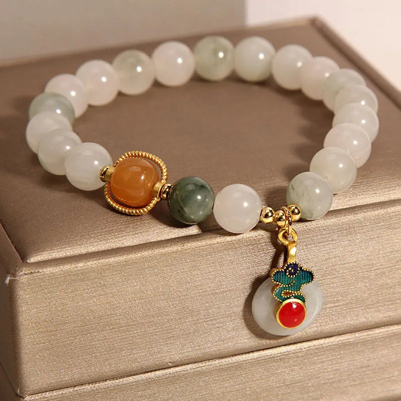 Women's ice jade bracelet with pearl accents and carved jade buckle clasp