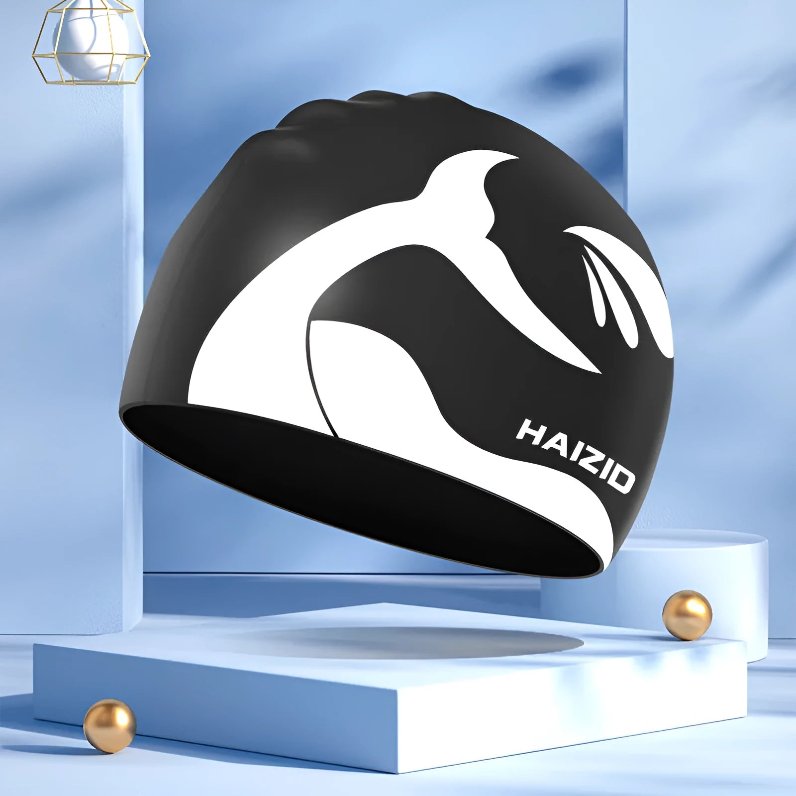 Silicone swimming cap with whale tail pattern and moulded ear protectors in various colours.
