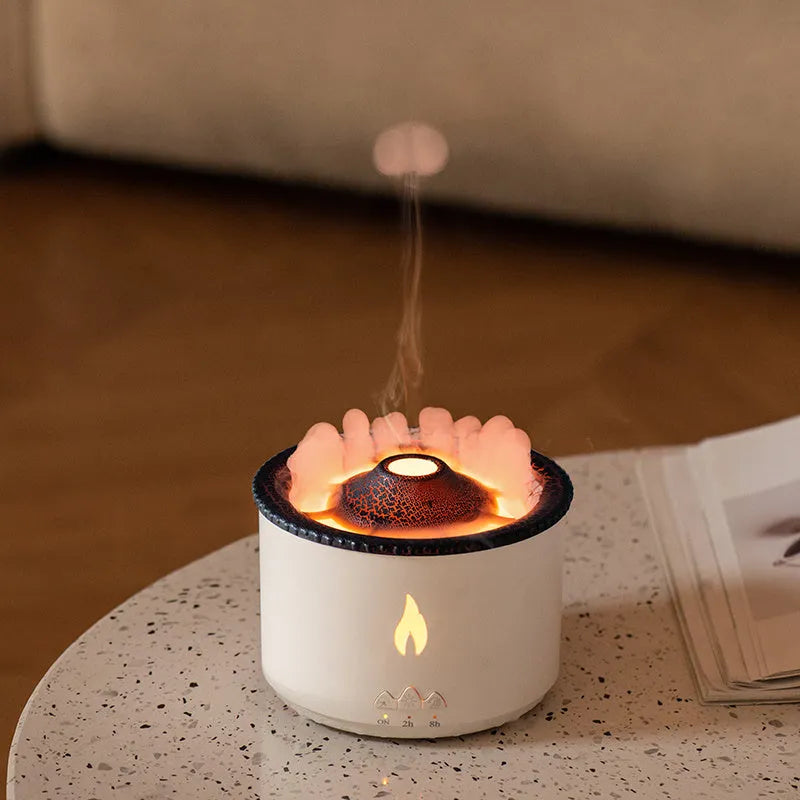 White flame and blue volcano humidifier diffuser with remote control on a table