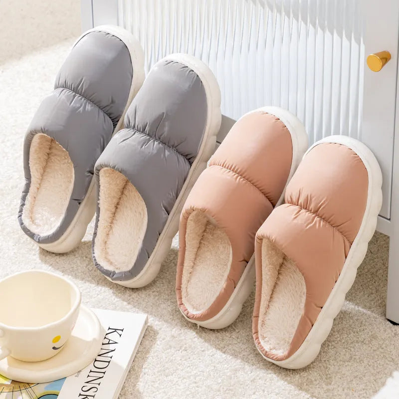 Pair of down cotton slippers with artificial leather upper and thick rubber sole, shown in available colours.