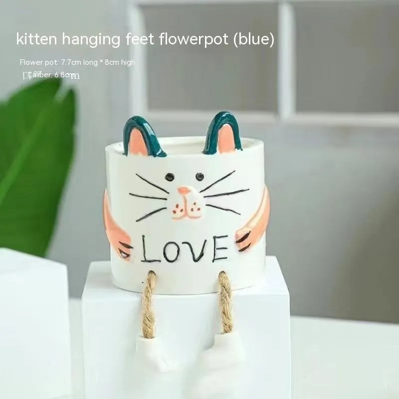 Ceramic hanging foot flowerpot in a cartoon style, shown as a desktop planter for succulent plants.
