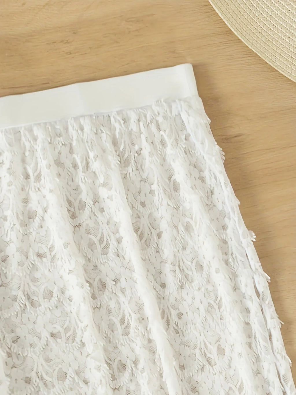 White three-piece swimsuit with long gathered skirt, sleeveless top, and briefs for swimming sports
