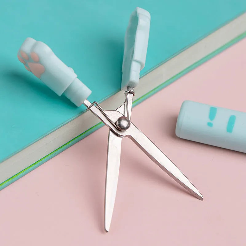 Creative cat claw folding scissors in pen type design, blue colour, on a white background