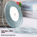 Roll of thin 0.6cm wide polyester ribbon in a selection of 22 colours including metallic gold and sky blue.