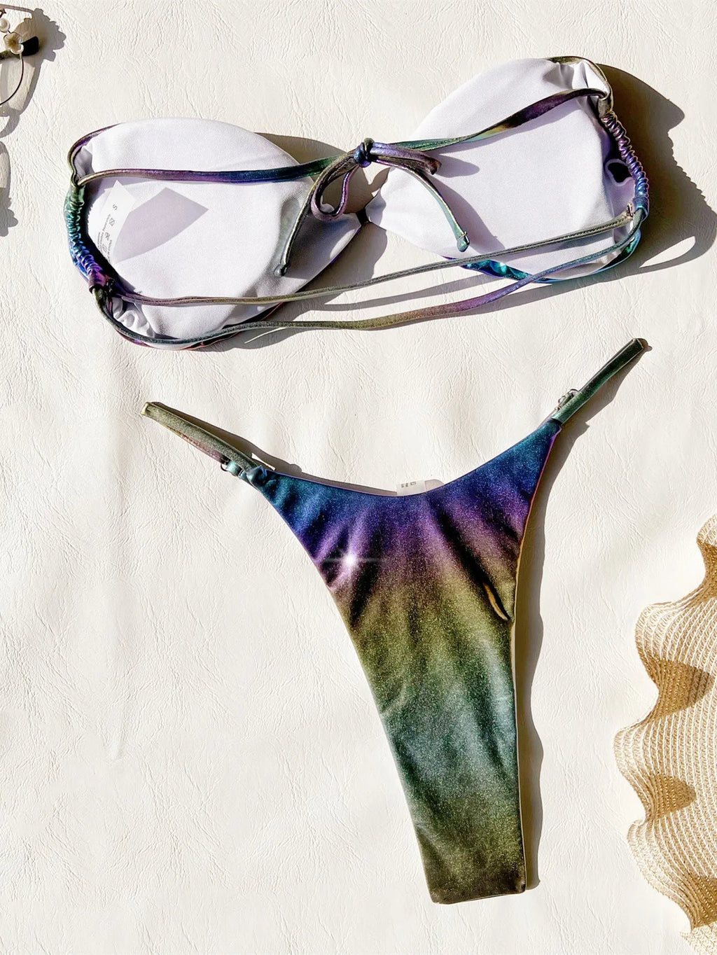 Women's purple gradient two-piece bikini swimsuit set on a mannequin.