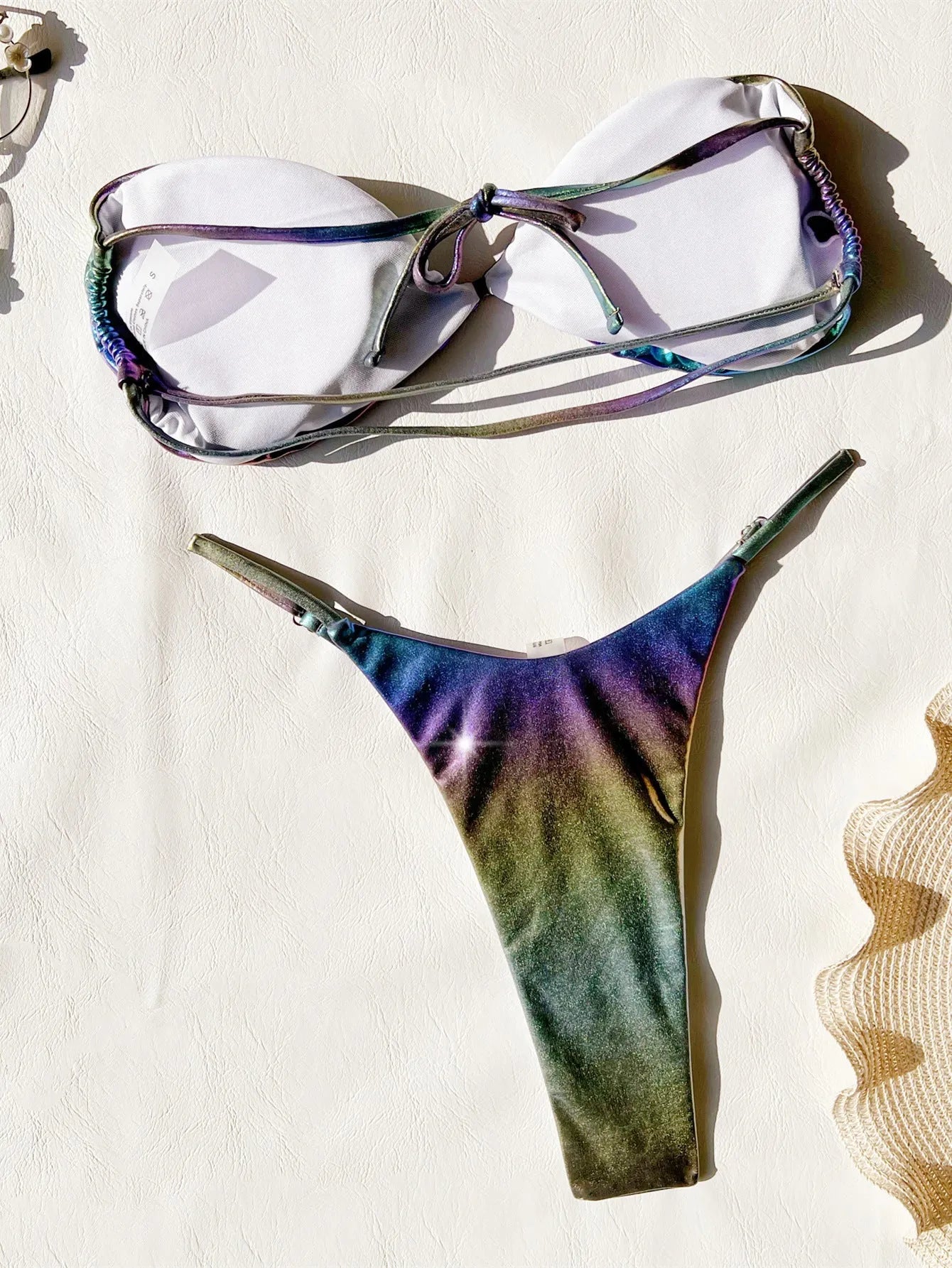Women's purple gradient two-piece bikini swimsuit set on a mannequin.