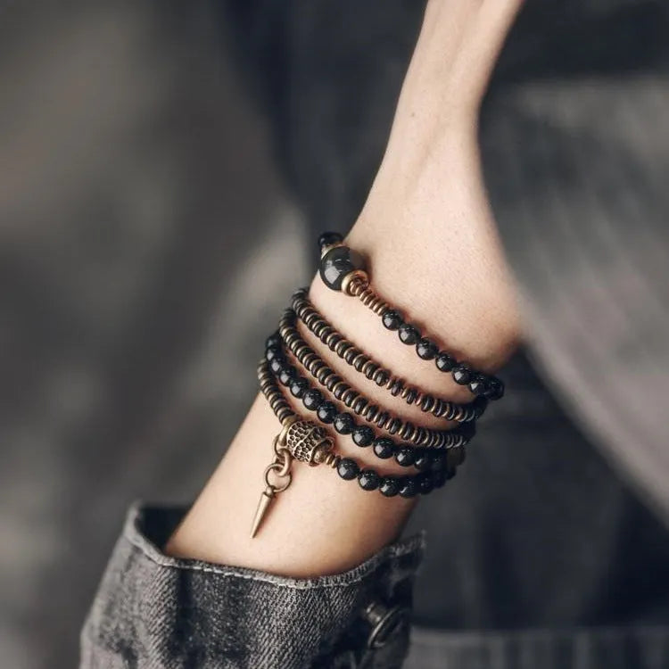 Black retro colourful geometric beaded bracelet with a multi-layered design.