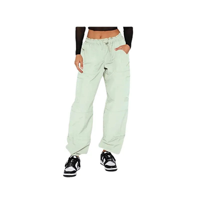 Man's loose-fit straight-leg cargo pants in polyester, shown in a choice of colours including khaki and grey.