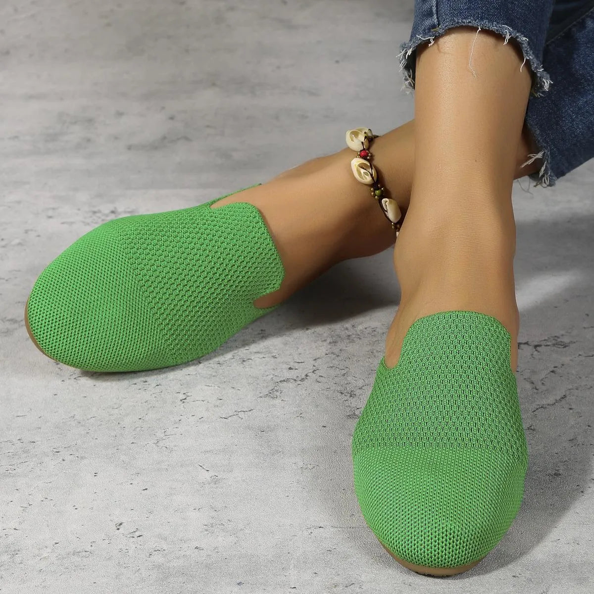 Women's apricot mesh slip-on sandals with round toe and rubber sole on a plain background.