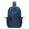 Grey men's chest bag worn across the shoulder, showing main compartment and waterproof-treated fabric.