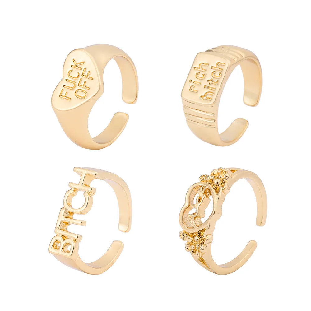 Vintage alloy ring set of four with heart shapes and letter cutouts, electroplated finish, colour JH1084