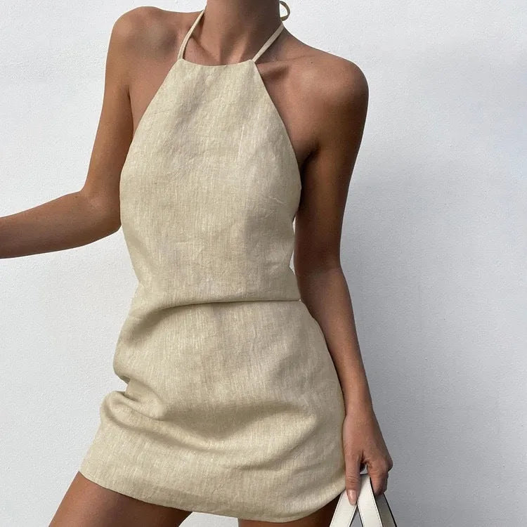 Women's solid colour linen A-line summer dress on hanger showing midi length and casual design