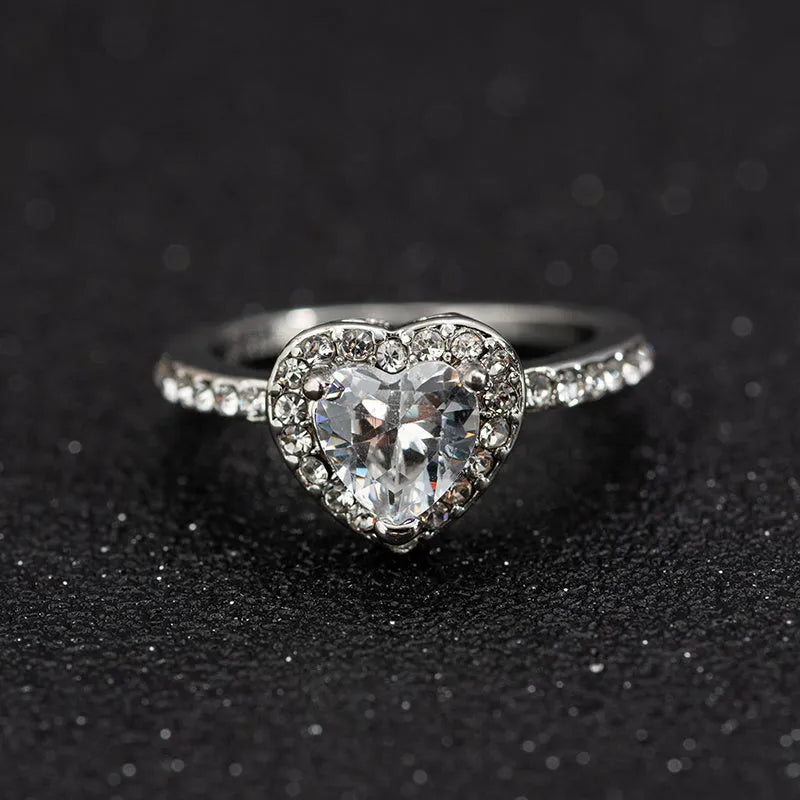 Women's heart-shaped wedding ring with crystal accents in rose gold or silvery finish