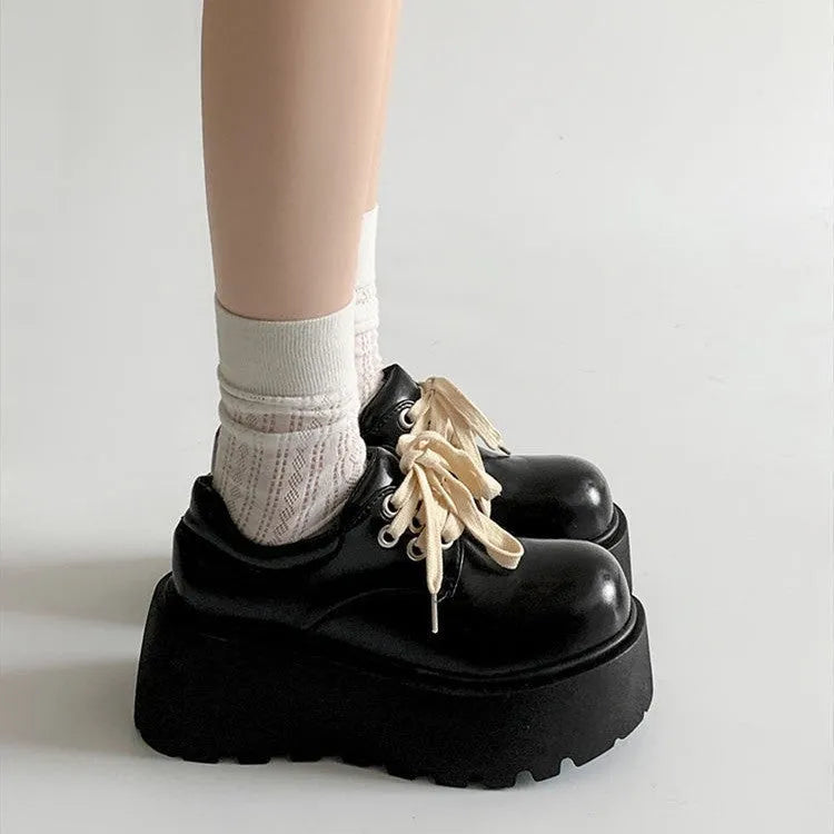 Matte black women's lace-up shoes with a thick rubber sole and a 6-8cm English muffin heel.