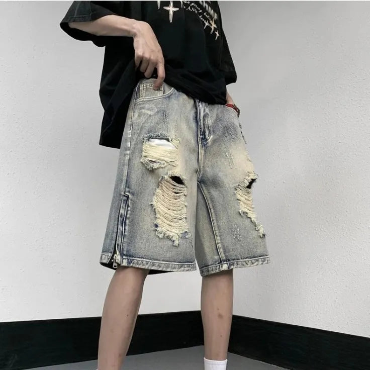 Blue retro style wide leg denim shorts with tattered detailing and loose fit