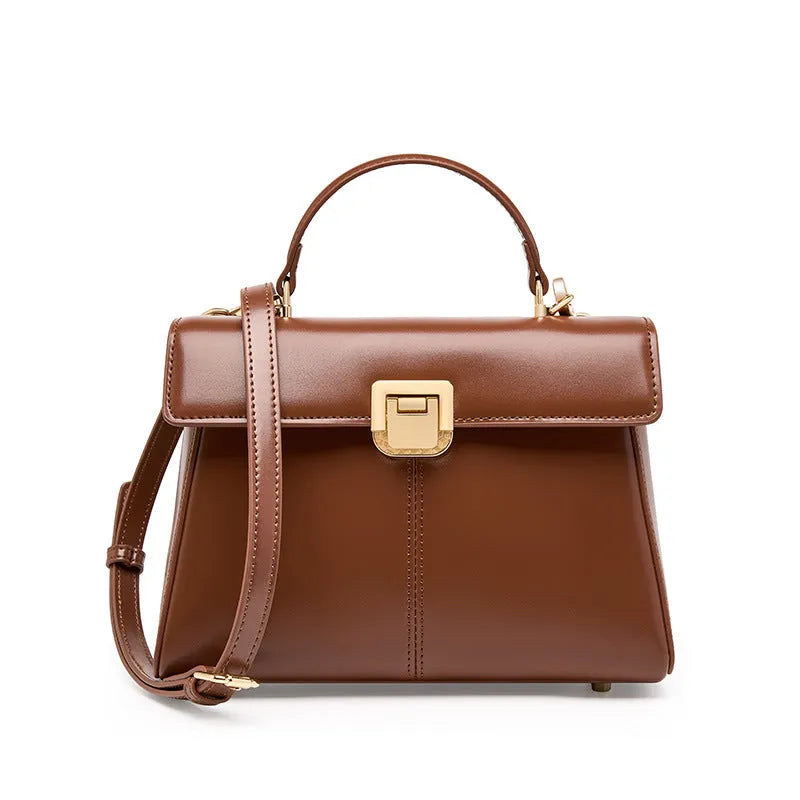 Dark brown women's genuine leather shoulder bag with a metal Vachette clasp, shown open to reveal an interior zippered pocket.
