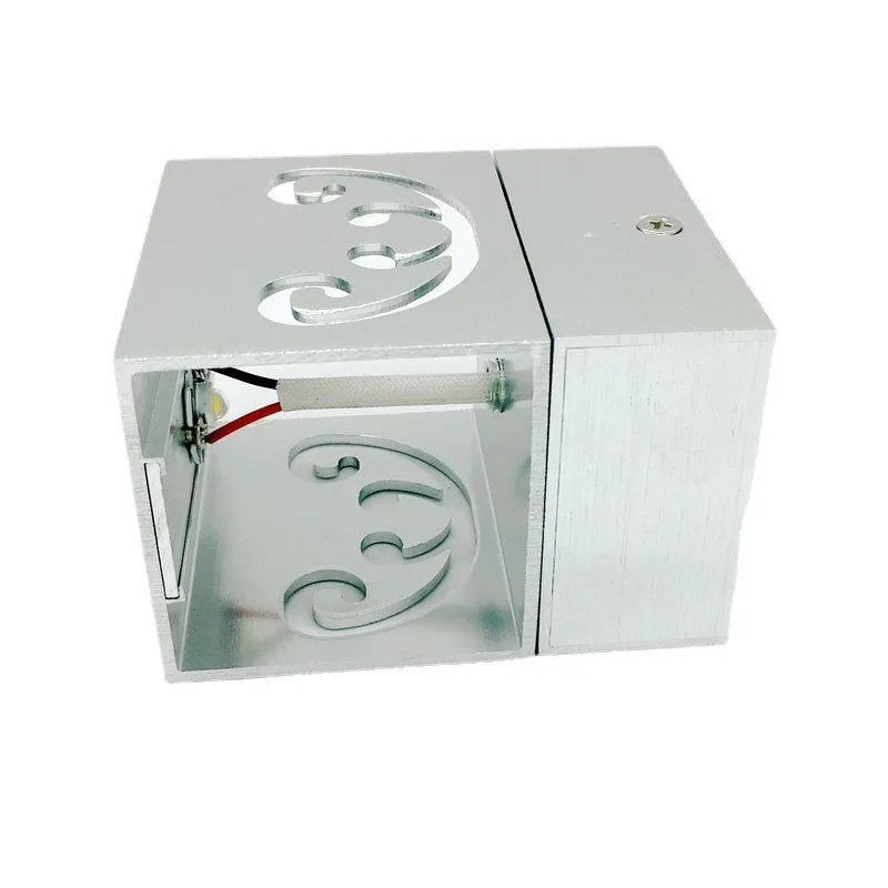 Modern aluminium butterfly-shaped LED wall lamp showing concealed and surface mount options.