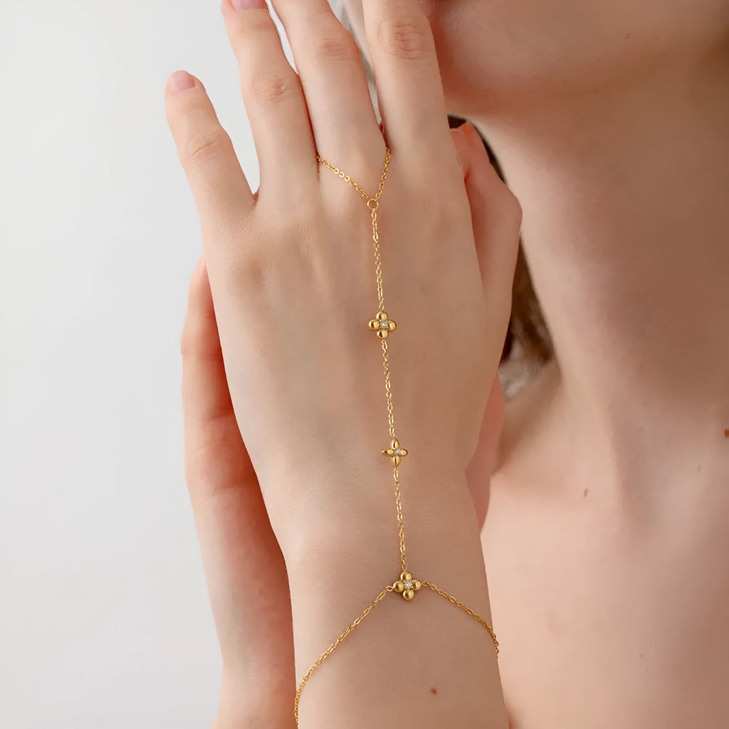 Women's stainless steel bracelet with geometric flower and eight-pointed star charms in gold colour