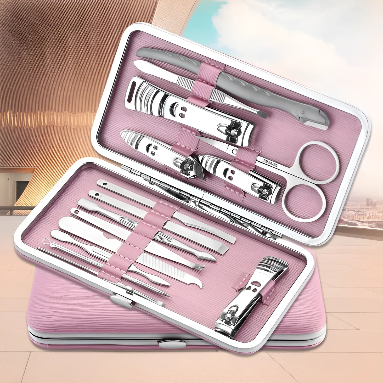 Pink 15-piece stainless steel manicure tool set in compact case measuring 15.5 by 8.2 by 1.3 cm