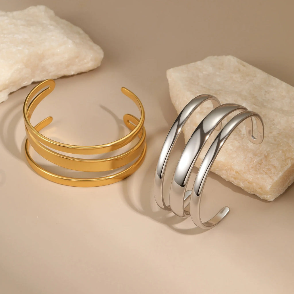Stainless steel geometric bracelet with simple opening mechanism in gold or steel finish