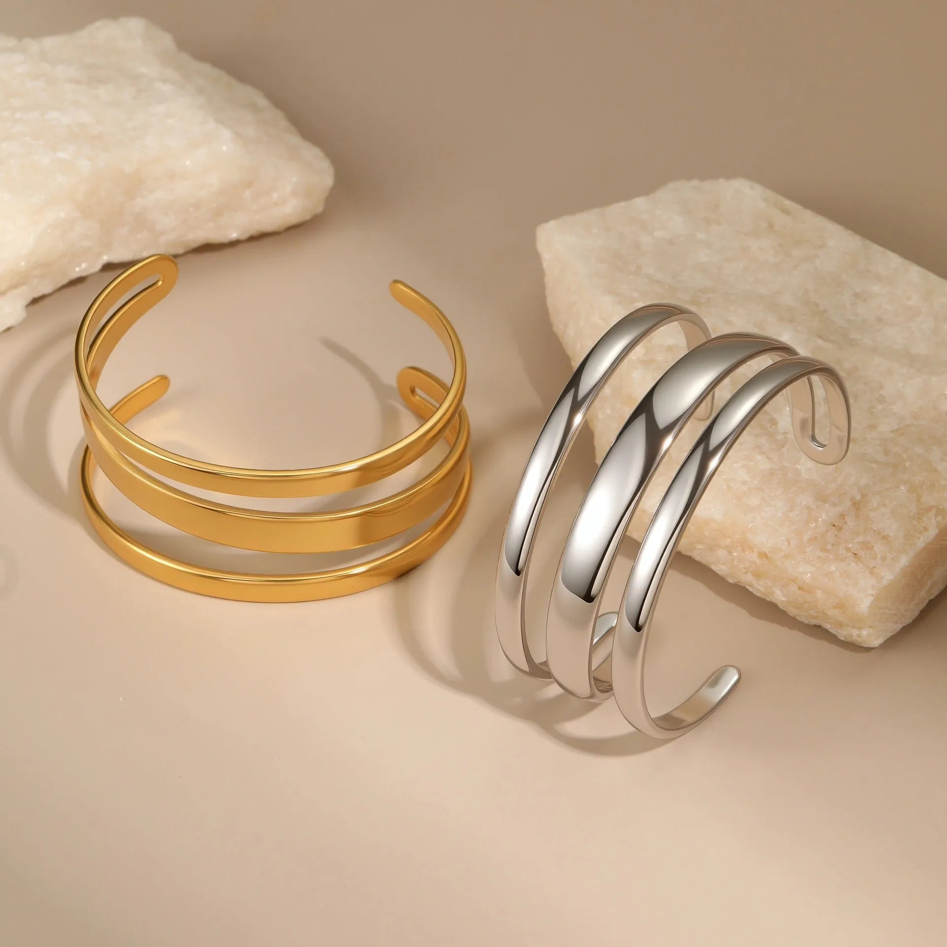 Stainless steel geometric bracelet with simple opening mechanism in gold or steel finish